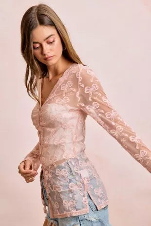 Dusty rose sheer mesh cardigan top with bow pattern, V-neck, long sleeves and button placket