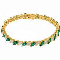 Gold tennis bracelet with emerald-green oval stones and small gold links