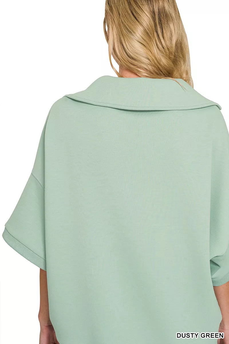 Dusty green collared pullover with short sleeves, back view
