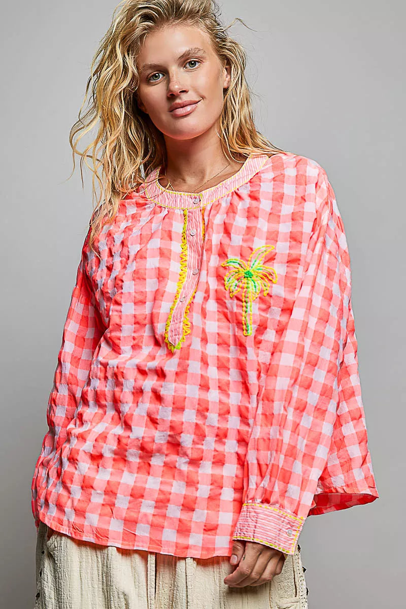 Pink gingham embroidered blouse with vertical trim and palm tree motif