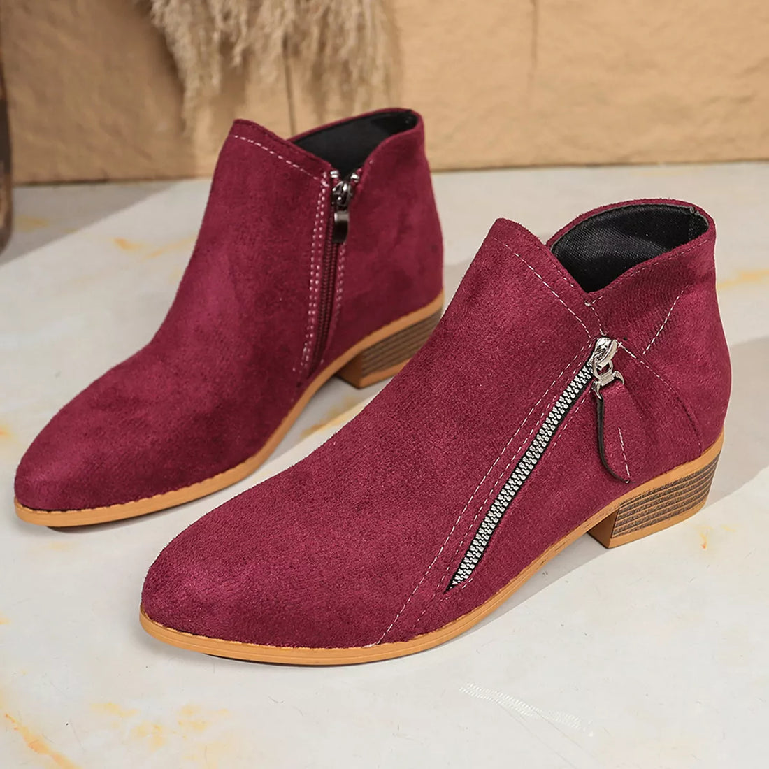 Burgundy suede point-toe block heeled ankle boots with side zipper and wood-look heel