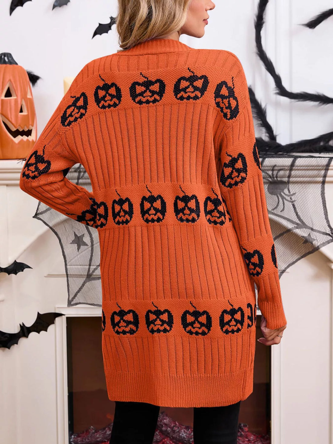 Orange open-front knit cardigan with black jack-o&