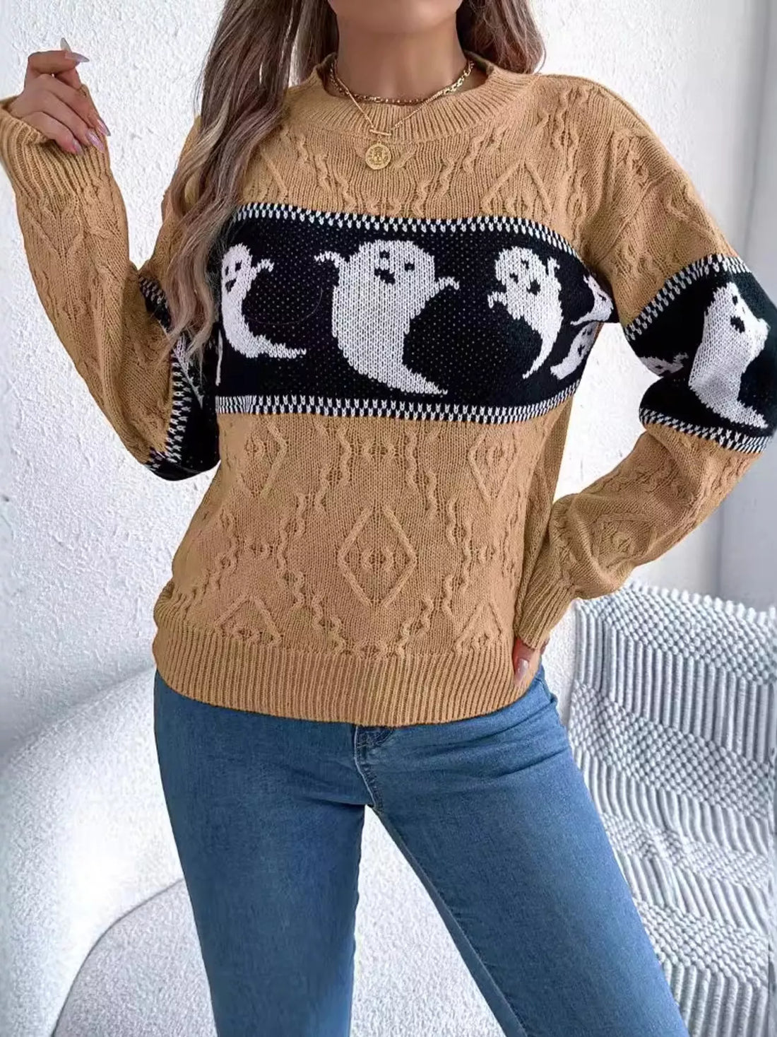 Camel textured sweater with black-and-white ghost intarsia across chest