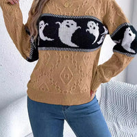 Camel textured sweater with black-and-white ghost intarsia across chest