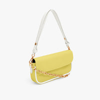 Yellow leather mini shoulder bag with flap front and gold chain strap, side view.