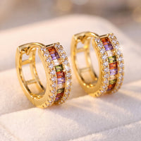 Gold baguette huggie hoop earrings with rainbow stones and clear pavé accents