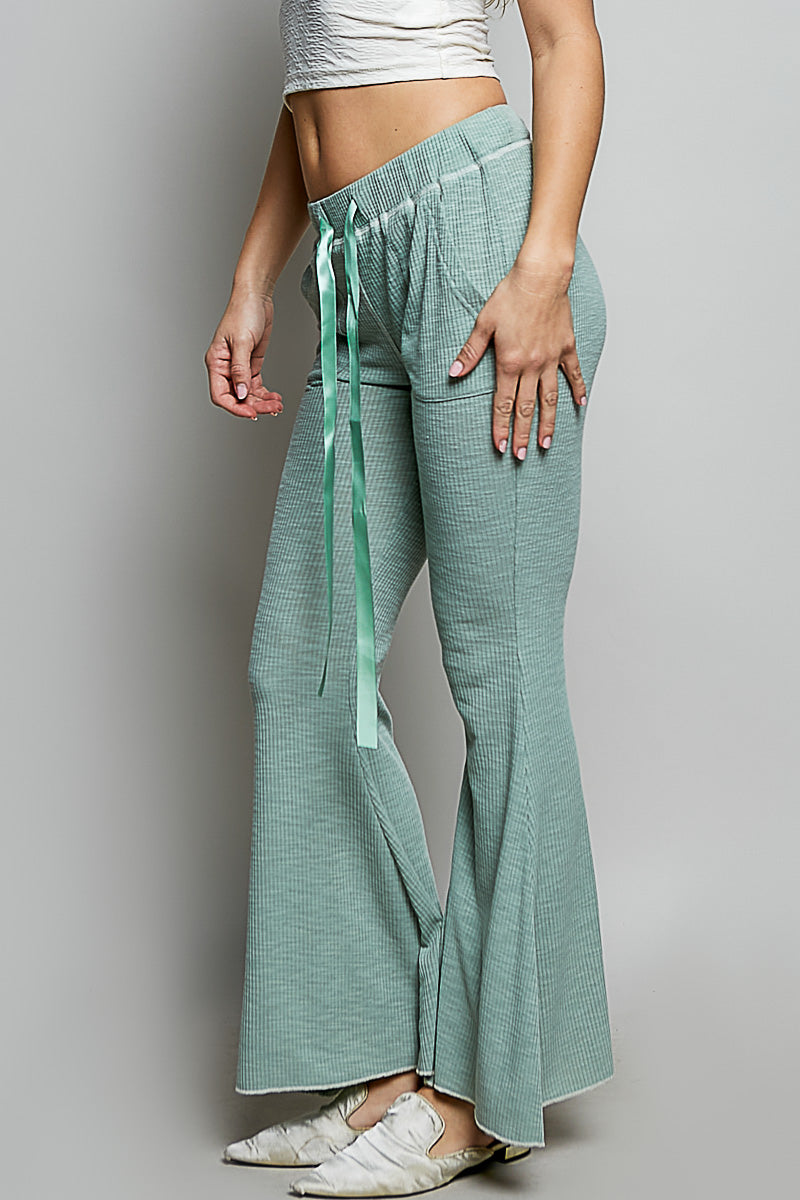 Pale sage ribbed knit pants with drawstring ties and wide flared legs