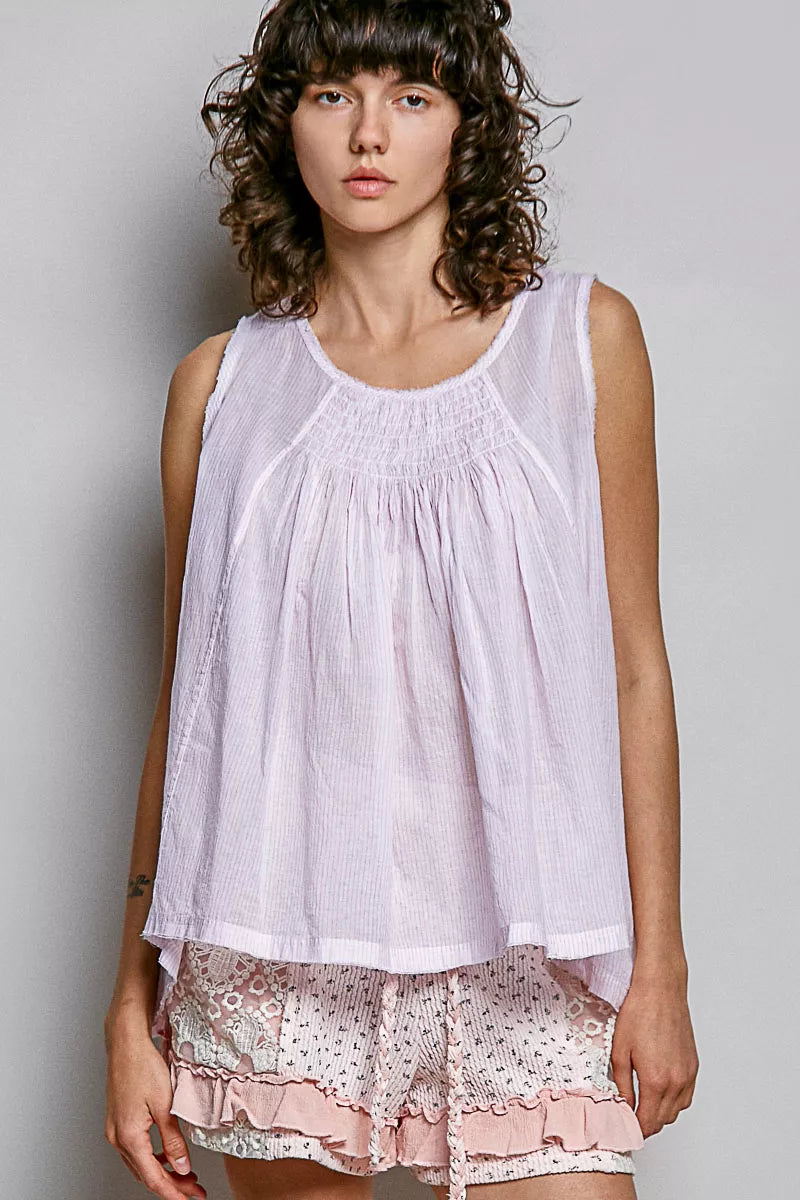 Lavender sleeveless cotton top with round neck, gathered pleats and scalloped hem