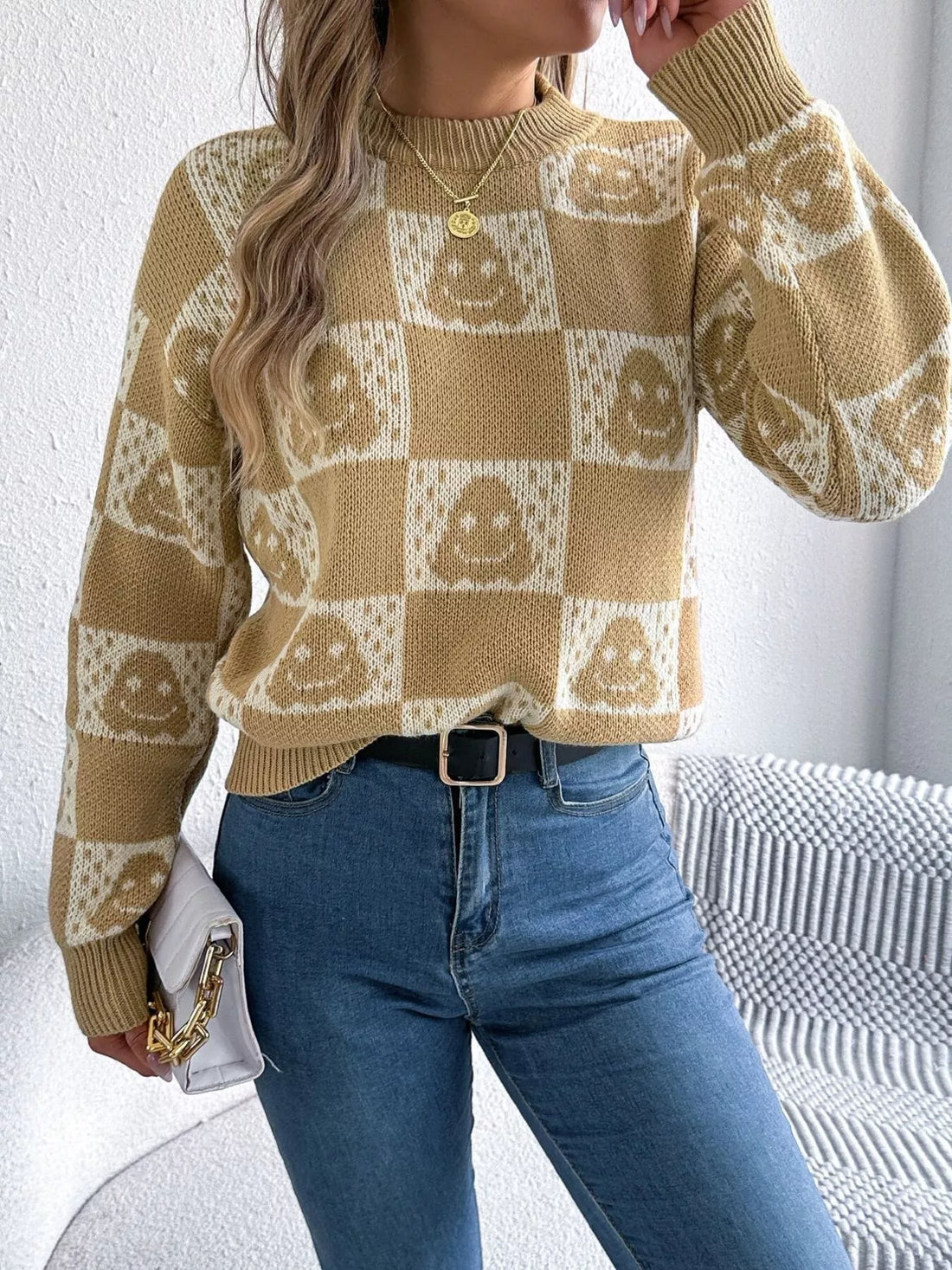 Tan checkerboard graphic sweater with jack-o-lantern faces, crew neck, long sleeves
