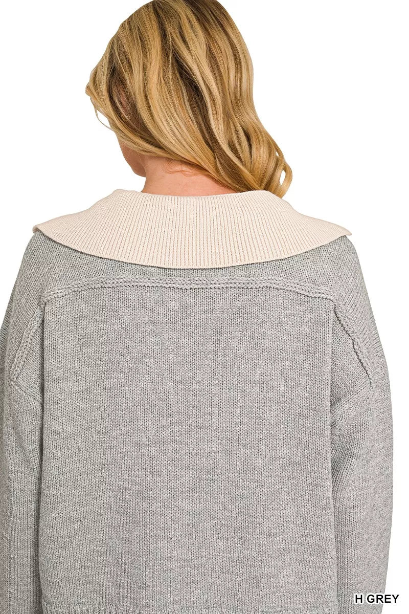Grey sweater with cream knit back collar and ribbed cuffs, V-neck visible