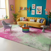 Large rectangular abstract rug with pink and green faded blotch pattern.