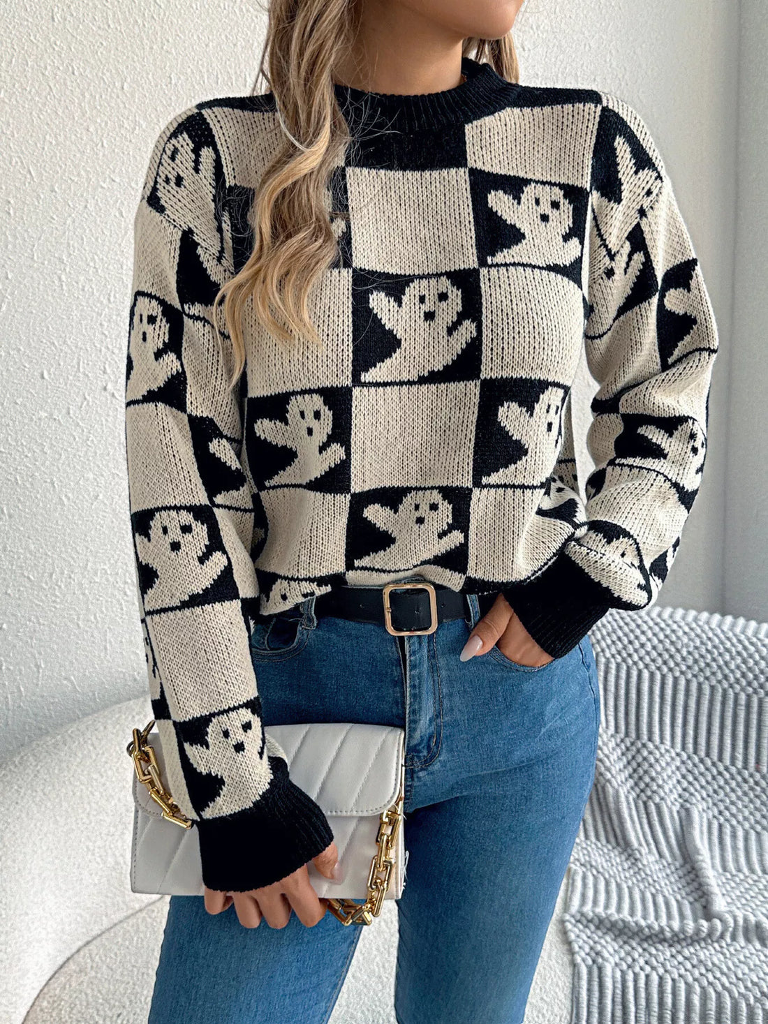 Ghost checkerboard knit sweater, black and cream pattern with ribbed crew neck