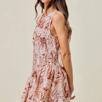 Coral and white shell-print sleeveless mini dress with smocked tiers and flared skirt