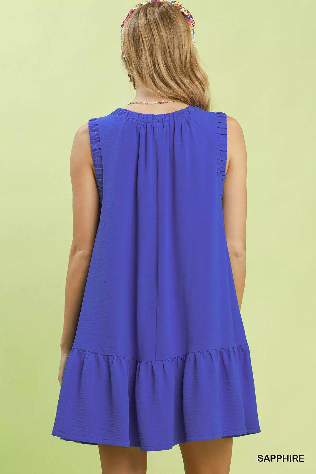 Sapphire blue sleeveless mini dress, ruched back yoke and tiered hem