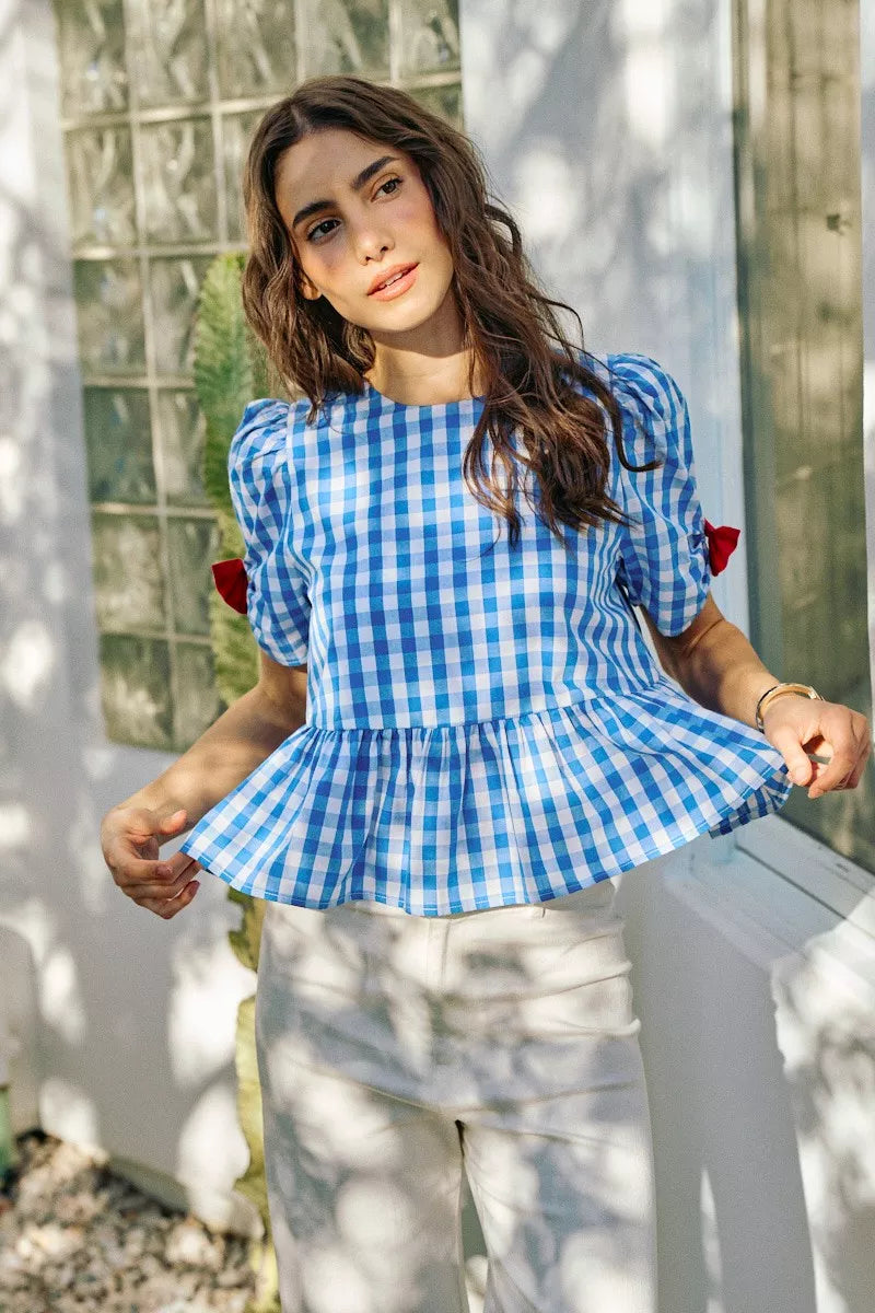 Blue gingham blouse with ribbon bow short sleeves and peplum waist