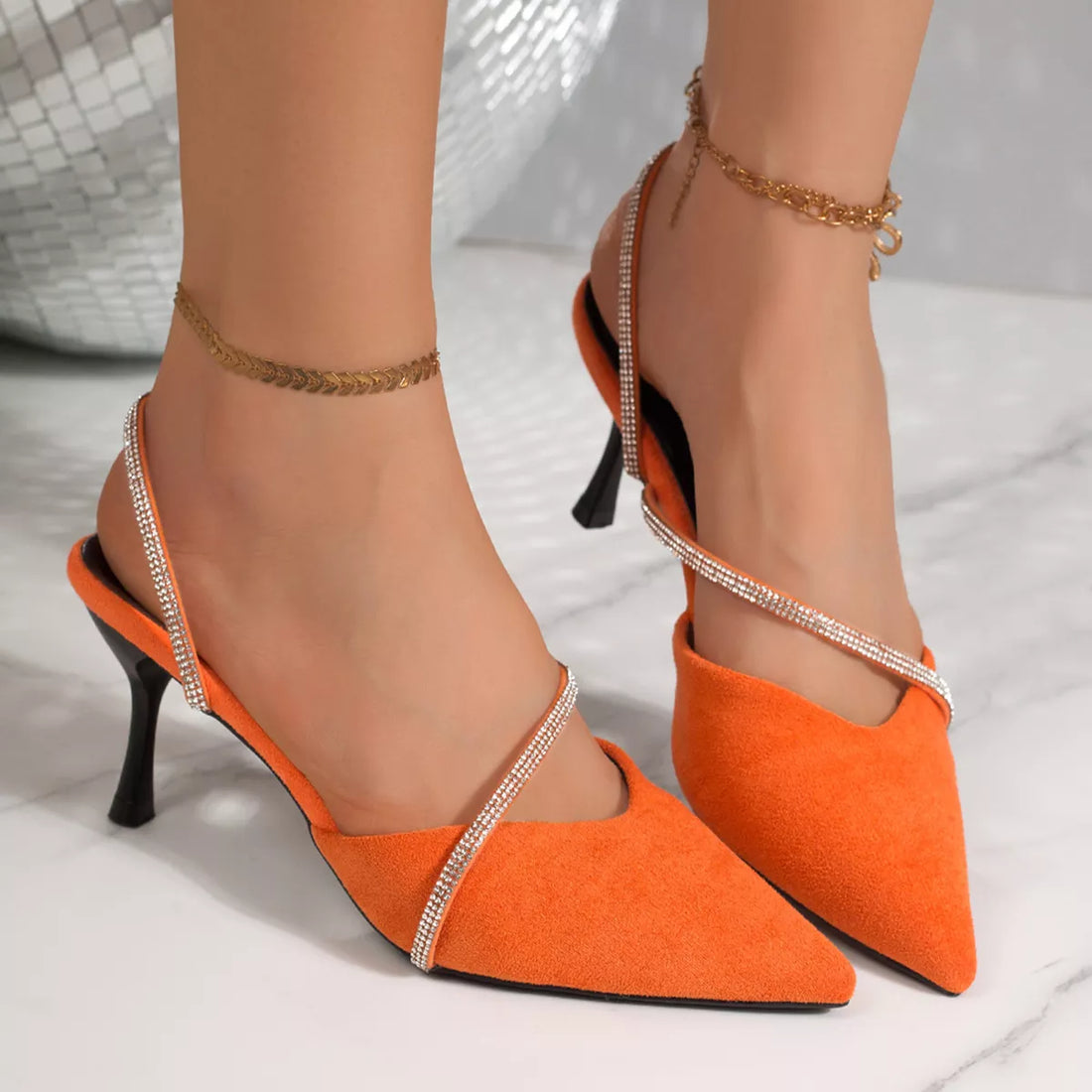 Orange suede point-toe kitten heel sandals with rhinestone slingback straps