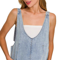 Light wash denim overall dress with square neckline and stitched front panel