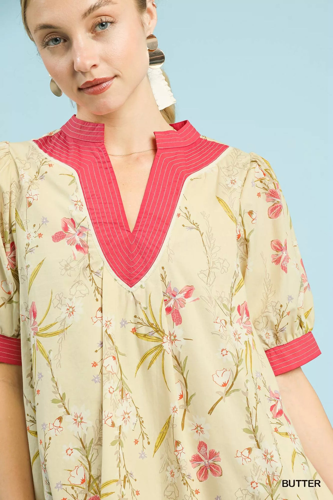Floral dress neckline with pink V-placket and contrast puff sleeves, butter-yellow