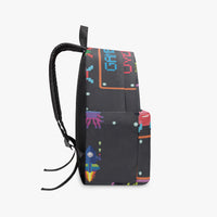 Kids canvas backpack side view in black with pixel characters and front zipper seam.