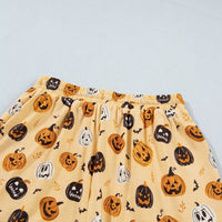 Gold Halloween pumpkin print lounge shorts, elastic waistband and all-over pattern
