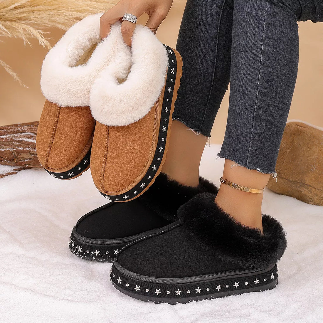 Black faux fur lined platform ankle boots with star-studded trim and chunky sole