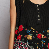 Black ribbed tank top with colorful floral woven patch and scoop neckline
