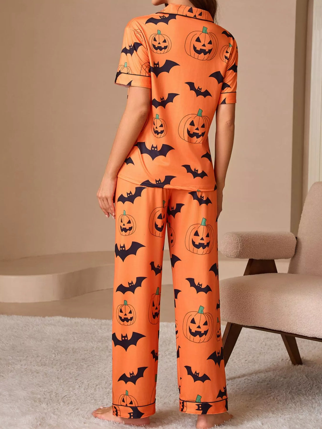 Orange pajama set with back button-up top and long lounge pants, pumpkin and bat print