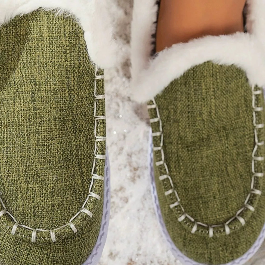 Green faux fur lined round toe slip-on shoes, close-up of front and fur trim