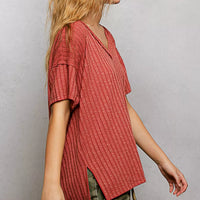 Terra cotta ribbed knit V-neck t-shirt with short sleeves and side slit detail