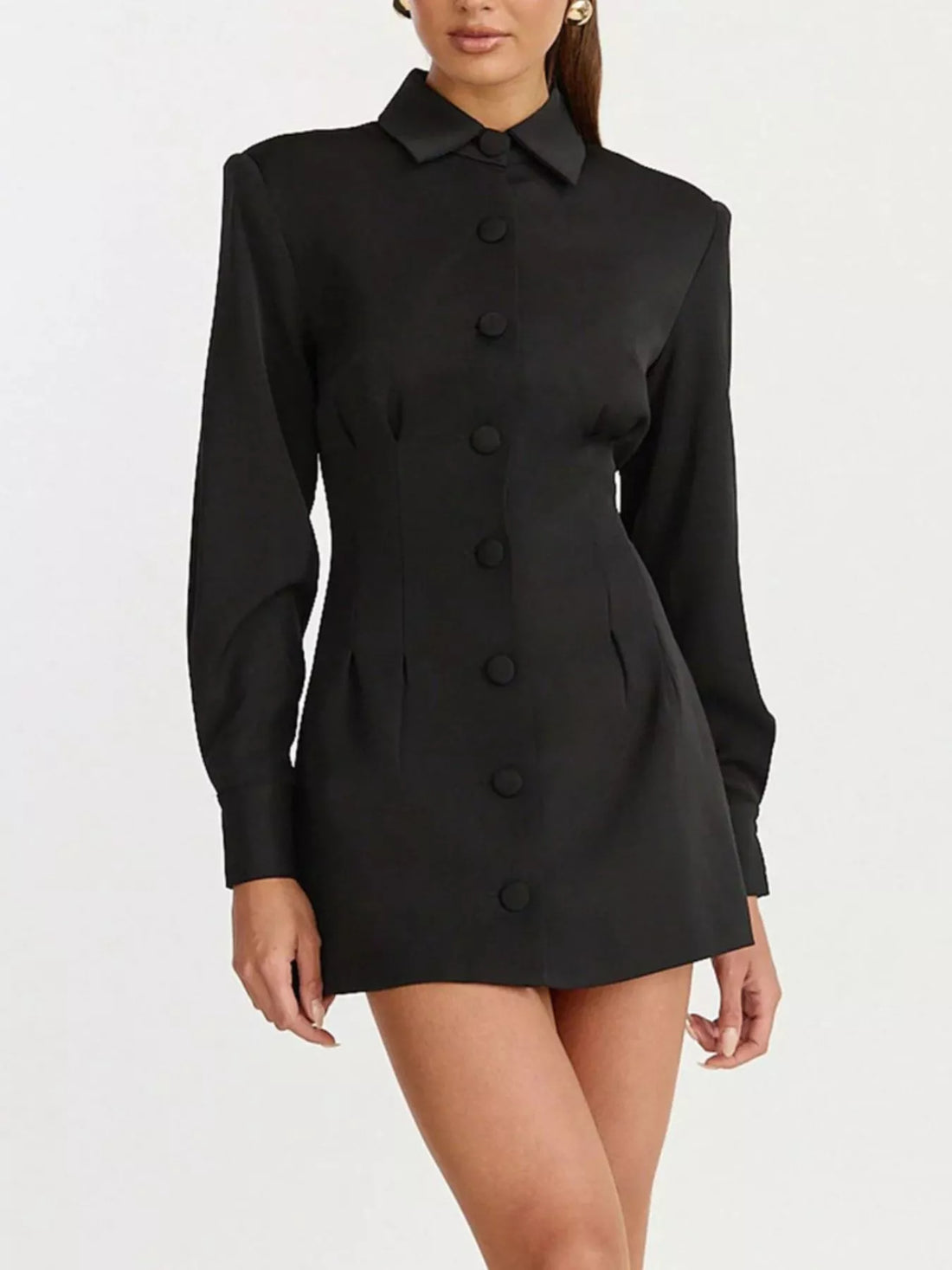 Black blazer mini dress with pointed collar, long sleeves, and buttoned front panel.
