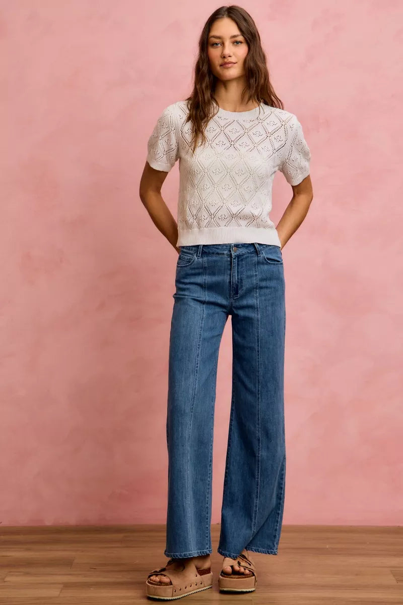 Mid-rise stretch denim jeans, straight-to-wide flared silhouette with belt loops