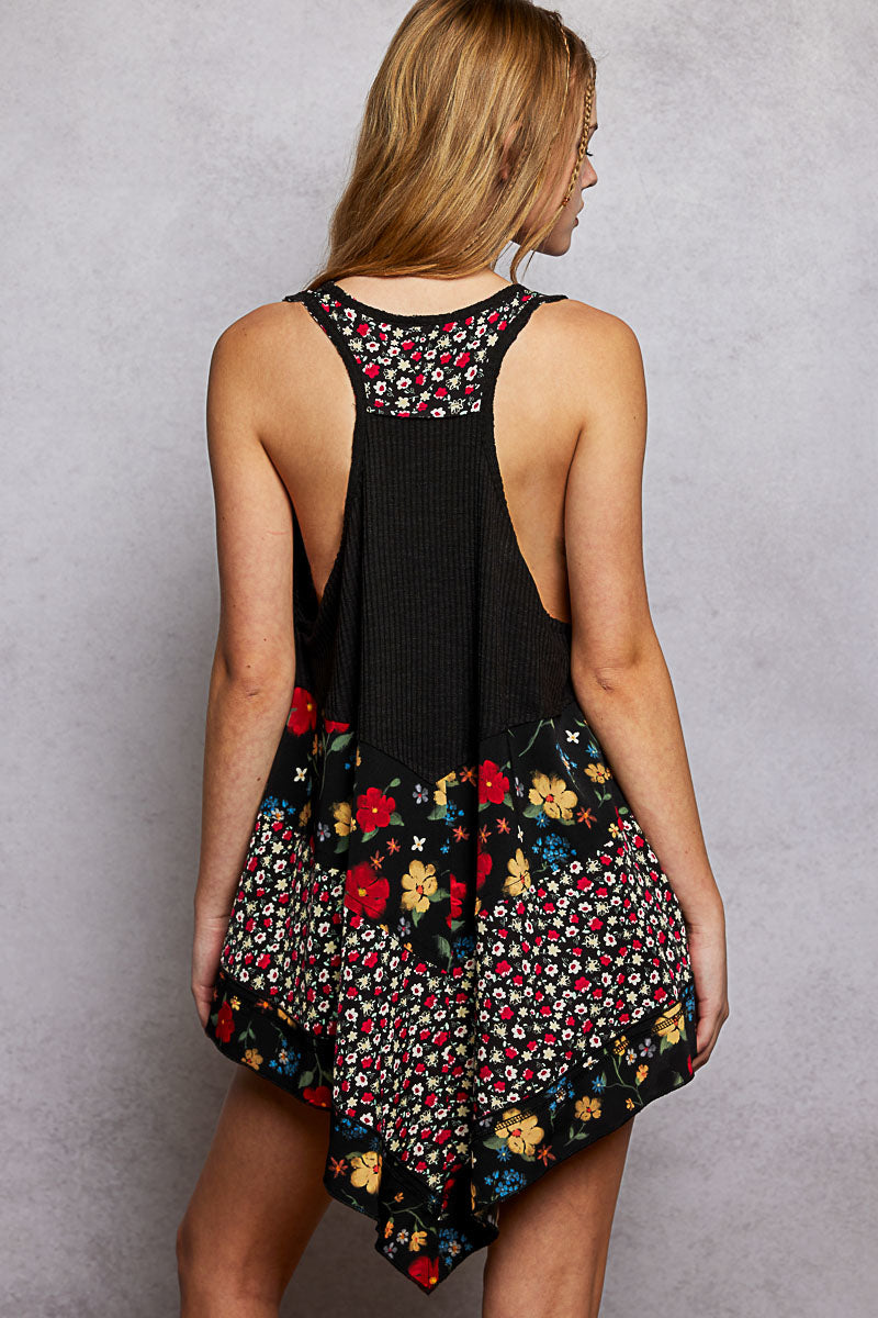 Back of black ribbed tank top with floral woven print patch and open scoop back