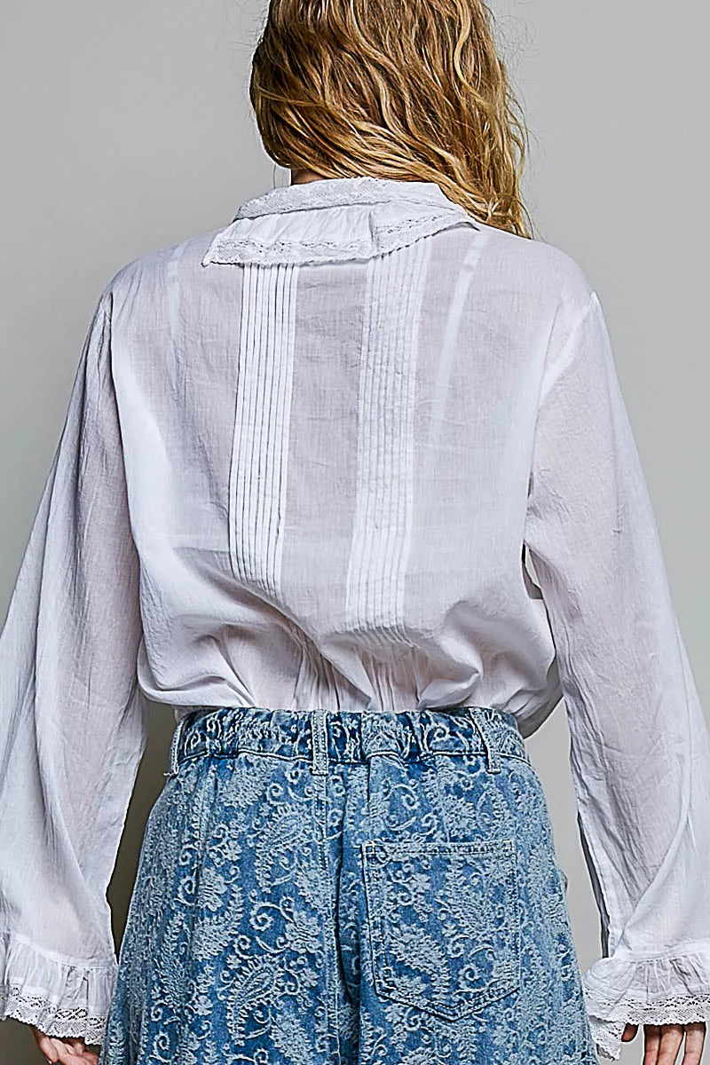 Back view of ivory lace-trim button-down shirt with vertical pintuck panels