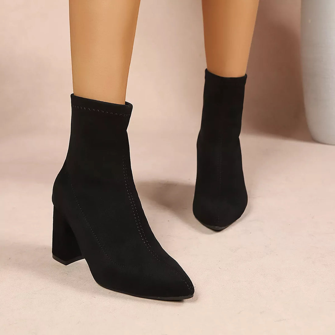 Black suede ankle boots with point toe and block heel, pull-on style