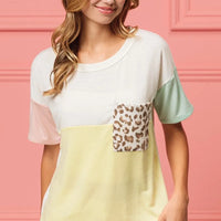 Color block crew neck top with leopard print front pocket and pastel sleeve color blocking
