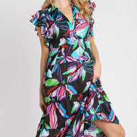 Plus size midi dress side view with ruffle sleeves and tiered hem, dark leaf print.