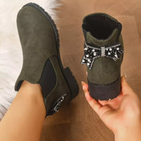 Olive green suede ankle boots with round toe, block heel, and jeweled pearl bow