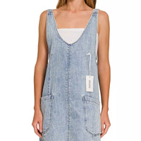 Light wash denim overall dress with square neckline and front pockets