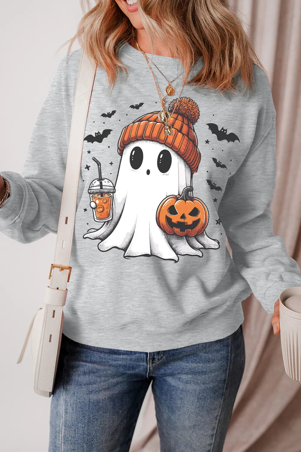 Gray long-sleeve crew sweatshirt with ghost, pumpkin jack-o’-lantern and bat graphic
