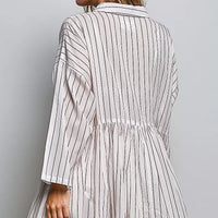Back view of striped woven shirt dress with gathered waist and long sleeves