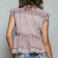 Pink sleeveless embroidered peplum blouse back view with gathered waist and ruffled hem.