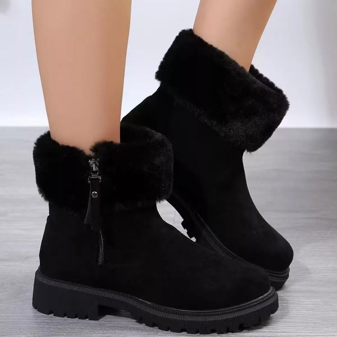 Black faux fur side-zip platform ankle boots with wide cuff and lug sole