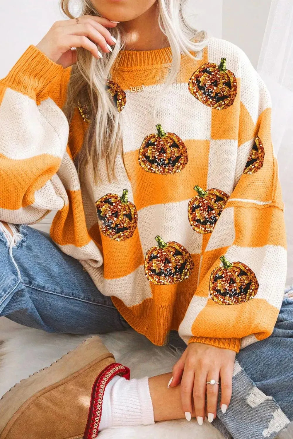 Tangerine and white checkered round-neck long-sleeve sweater with pumpkin sequin patches