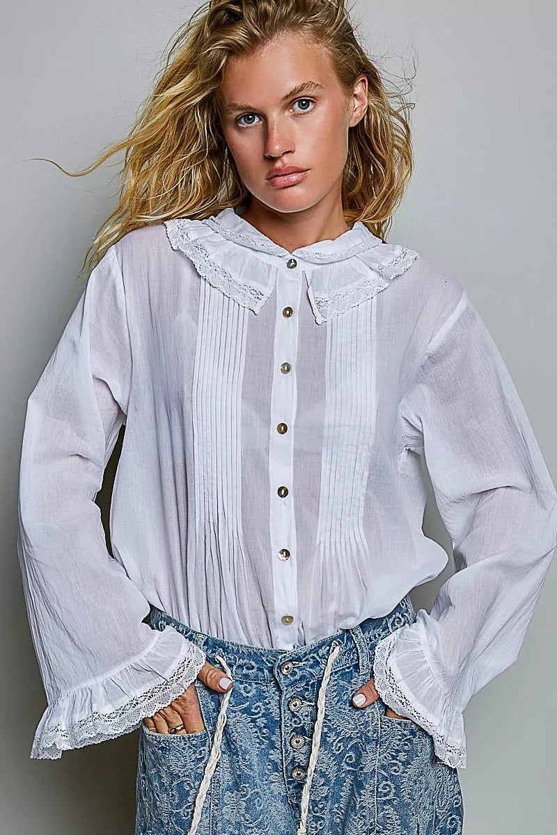 Ivory lace-trim button-down shirt featuring ruffled collar and pintuck button placket