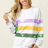White crew-neck sweatshirt with sequin-striped front in purple, yellow, and green