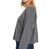 Dark gray long-sleeve pullover, side profile