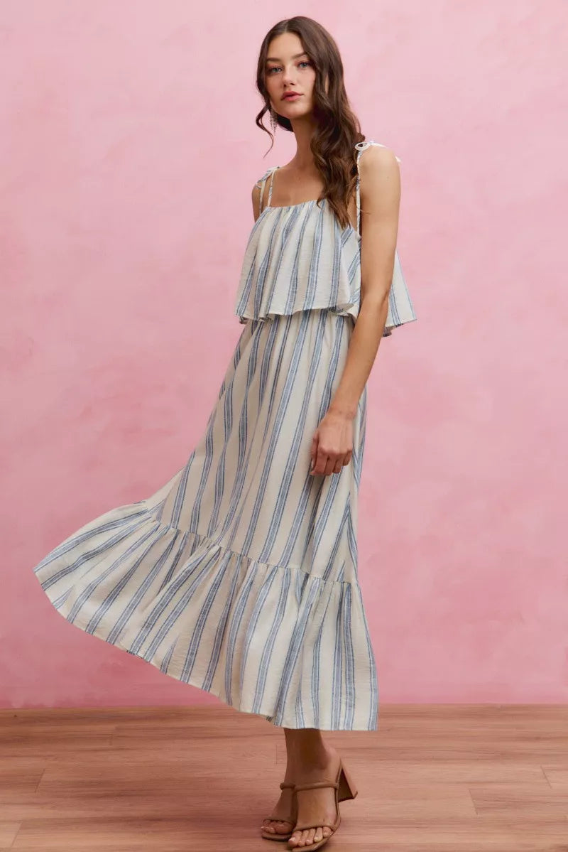 Sleeveless vertical stripe midi dress with tiered ruffle skirt and thin tie shoulder straps