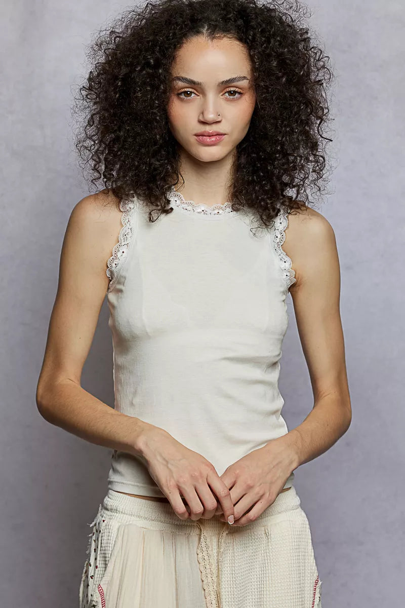 Cream round-neck cropped tank with scalloped lace trim at neckline and armholes