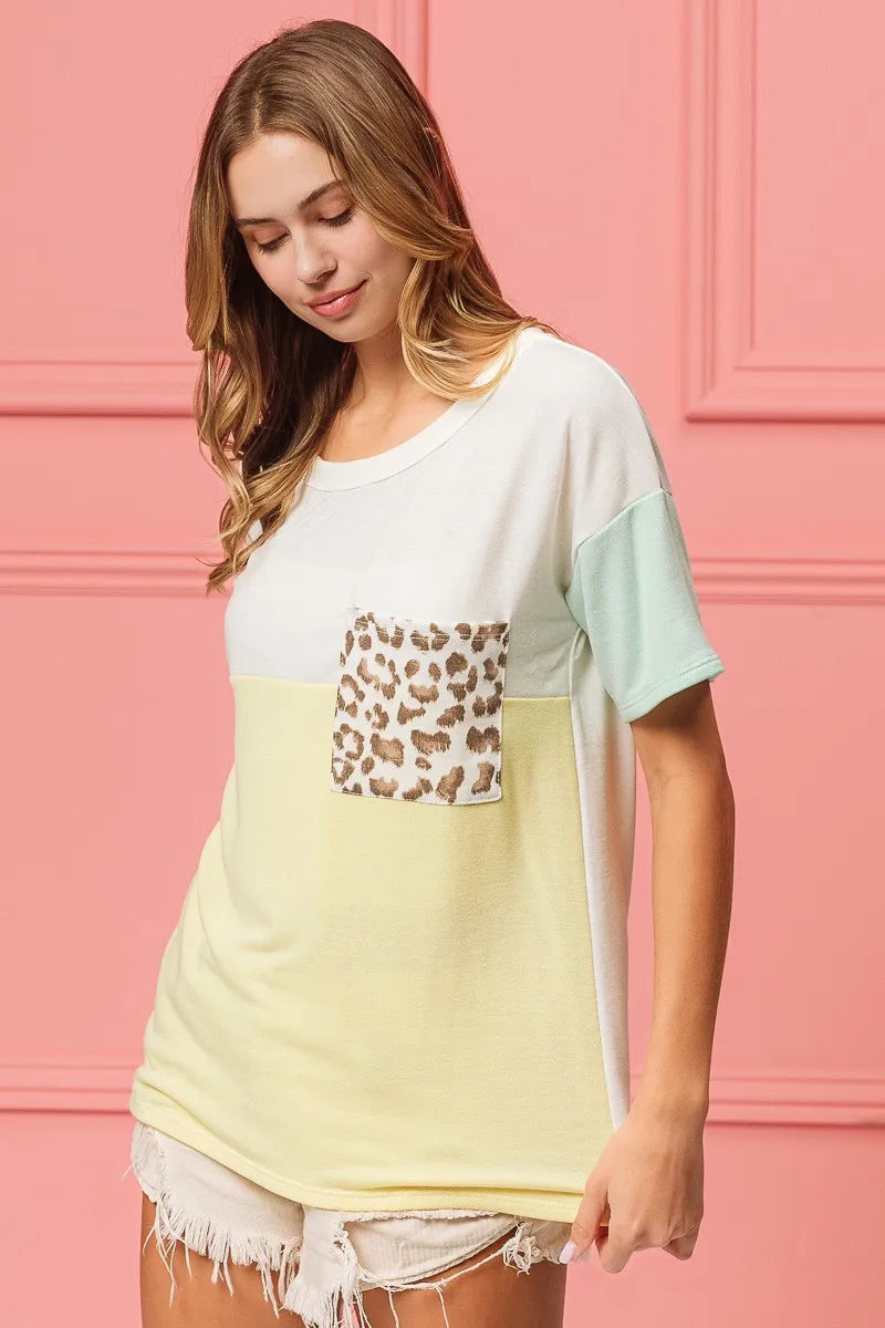Color block crew neck T-shirt with leopard pocket detail and mint sleeve panels, pale yellow front