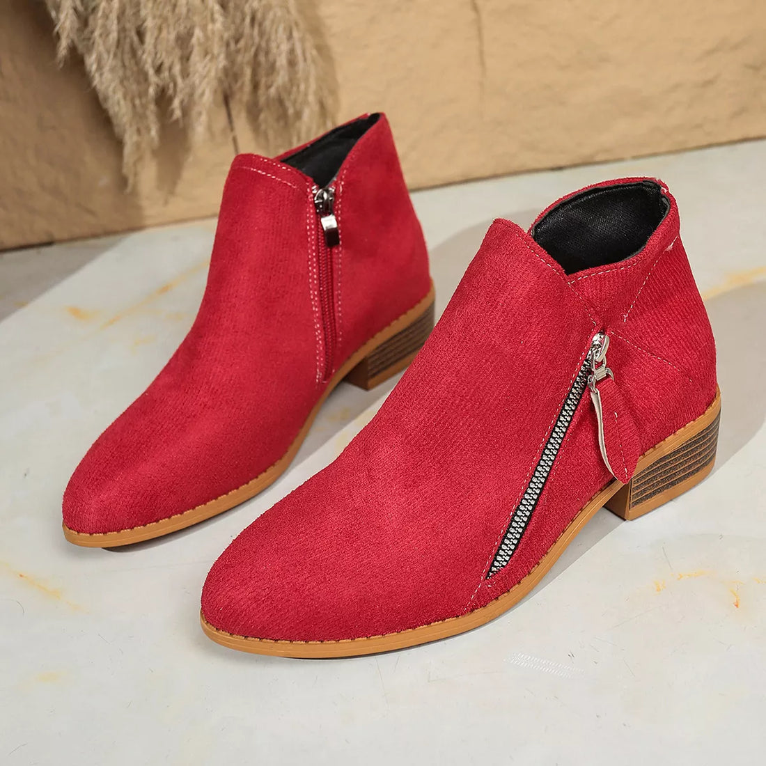 Red suede point-toe block heeled ankle boots with side zipper and wood-look heel
